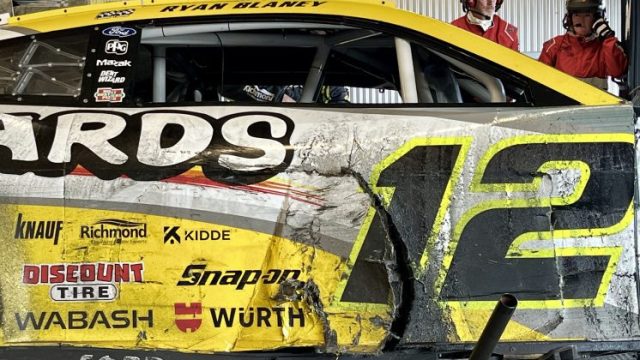 Damage to the right side of Ryan Blaney's No. 12 Team Penske Ford after a crash at Talladega Superspeedway.