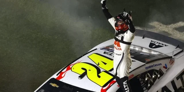 William Byron, driver of the No. 24 Axalta Chevrolet, celebrates after winning the NASCAR Cup Series Daytona 500 at Daytona International Speedway.