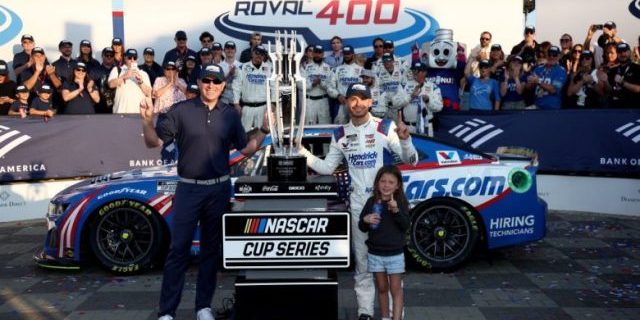 Kyle Larson, driver of the No. 5 HendrickCars.com Chevrolet, celebrates with his daughter, Audrey Larson in Victory Lane after winning the NASCAR Cup Series Bank of America Roval 400 at the Charlotte Motor Speedway Roval (image courtesy NASCAR)