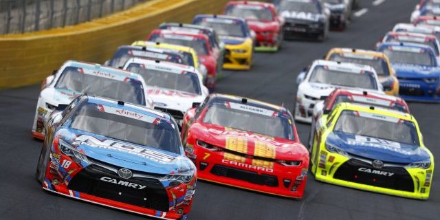 Kyle Busch (18) brings his car through the turns during the Alsco 300 at Charlotte Motor Speedway in Concord, North Carolina (Photo by actionsports/Deposit Photos)