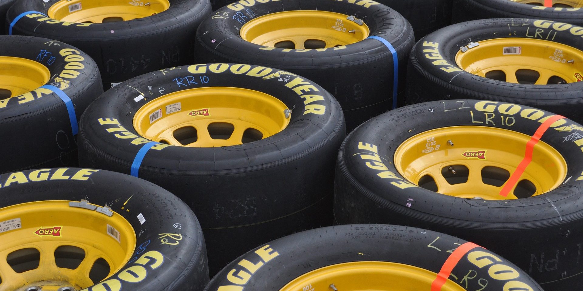How much does a NASCAR race tire weigh?